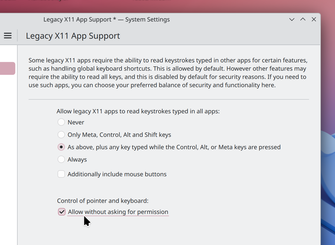 System Settings window showing the option to allow XWayland-using apps to control the keyboard and pointer